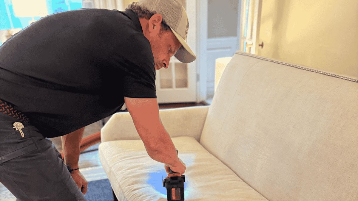 Louisville Mold Cleanup technician cleaning upholstery in a Louisville home